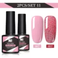Set di 2 smalti gel Née Jolie da 8,5 ml con rosa confetto e glitter rossi brillanti. - Set da 2 / Rosa Chiaro (007) e Brillantini Rossi Fini (057)