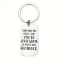 Macro detail of a stainless steel keychain with engraved inspirational quote reminder - English Reminder You Are Awesome (ALYSK-0024-6)