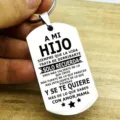 Close-up of stainless steel dog tag keychain with Spanish inspirational text engraving. - Spanish Mother Son Quote (ALYSK-0024-2)