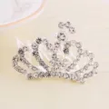 Close-up of children's silver rhinestone crown hair comb with heart peacock design - Peacock Heart Hollow Crown Hair Comb (Style 4)