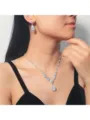Detailed view of an elegant bridal V-neck zircon necklace and teardrop earrings set. - Necklace and Earrings Set / Silver Pave Rhinestone (002)