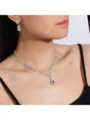 Detailed macro shot showing elegant teardrop bridal necklace and earring set on a model - Necklace and Earrings Set / Silver Pave Rhinestone Water Drop (004)