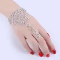 Detailed view of sparkling rhinestone slave bracelet with ring for bridal or dance - Woven Style Hand Chain / Silver