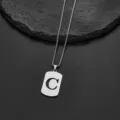 Detail of stainless steel box chain necklace with a cut-out letter C pendant - Letter C