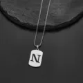 High-quality close-up of stainless steel necklace with rectangular black letter N pendant - Letter N