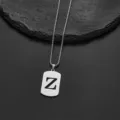 Macro view of stainless steel rectangular pendant with hollow 'Z' initial cutout - Letter Z