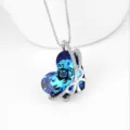 Sparkling blue heart-shaped crystal pendant necklace with a diamond-studded silver bow. - Bowknot Style / Dark Blue