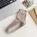 Beige mid-calf non-slip yoga socks featuring ruffled cuffs and heart embroidery detail - Khaki