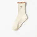 Cream women's yoga socks with non-slip silicone grips and brown embroidered bow detail - Cream with Coffee Trim