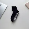 Professional black yoga socks with heart embroidery and anti-slip silicone grippers on the sole - One Size / Black