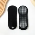 Calcetines de yoga antideslizantes negros con puntos blancos para uso en el hogar. - Negro