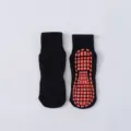 Atmungsaktive schwarze rutschfeste Trampolinsocken mit roten Silikongreifsohlen für Sicherheit - Kinder (1-4J) / Schwarz