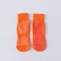 Rutschfeste Trampolinsocken in Orange mit atmungsaktivem Mesh für Kinder und Erwachsene - Kleinkinder (1-4J, EU 23-29) / Orangerot