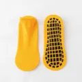 Professionelle gelbe rutschfeste Söckchen mit schwarzen Gummigriffen für Yoga & Sport - Orange