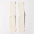 Off-white cotton yoga crew socks with anti-slip silicone dots on sole. - White