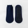 Paar dunkelblaue rutschfeste Yoga- und Trampolinsocken mit schwarzen Silikon-Grippern - Dunkelmarineblau
