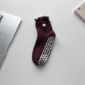 Dark brown non-slip yoga socks featuring white heart embroidery and stylish ruffle trim detail - One Size / Coffee