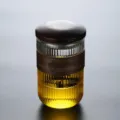 Premium heat-resistant glass tea cup with dark wooden lid and insulated grip band - 401-500ml / Vertical Style