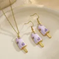 Detail macro view of purple enamel popsicle jewelry set with heart patterns. - Purple Ice Cream Set / Purple