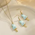 Detailed view of light blue enamel popsicle earring and necklace set with heart patterns - Blue Ice Cream Set / Blue