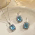 Detail view of bridal jewelry set with rectangular aquamarine blue zirconia stones - Rectangular Style (10864) / Necklace and Earring Set / Aquamarine/Silver