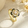 Detailed view of elegant rotatable flower ring with pearl, black enamel and crystals - Black and Gold Contrast Style (80344) / Open Adjustable