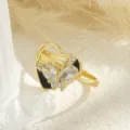 Detailed close-up of a gold-plated heart ring featuring a rotating butterfly with zirconia - Butterfly Heart Style (80345) / Gold