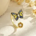 Detail of gold-plated butterfly and flower open ring with blue and yellow enamel - Blue And Yellow Enamel Style (80338) / Open Adjustable