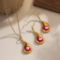 Close-up of gold-plated evil eye necklace and earrings set with red enamel detail - Red Waterdrop Style (80480)