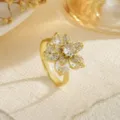 Macro view of an elegant gold rotating flower ring featuring sparkling clear zircon petals - Five-Petal Pear-Shaped Diamond Style (80374) / Open Adjustable