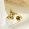 Close-up of gold-plated open ring with colorful enamel butterfly and blue zircon flower. - Red And Green Enamel Style (80338) / Open Adjustable
