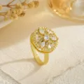 Detailed view of gold-plated rotating ring with marquise and round cubic zirconia - Flower Cluster (80368) / Open Adjustable / Gold