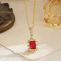 Detailed view of the vintage emerald cut red zircon necklace in an elegant gold setting - Pendant Necklace (80492) / Red
