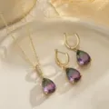 Close-up of vintage jewelry set featuring gradient teardrop gemstones and gold finish. - Jewelry Set (11681) / 11681-Green and Red
