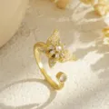 Close-up of rotating gold-plated butterfly ring with sparkling cubic zirconia stones. - Full White Zirconia Style (80339) / Open Adjustable