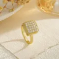 Macro view of a luxurious rotatable square gold ring pavé-set with sparkling cubic zirconia - Square Pave Style (80386)