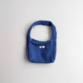 Close-up view of the soft blue knitted fabric texture on this stylish handbag - 19*14 / Dark Blue