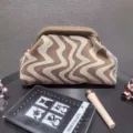 Close-up of wavy pattern knit cosmetic bag with frame closure and large capacity - Khaki
