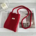 Handmade red knitted crossbody phone bag with long strap and minimalist egg tag - Red