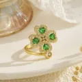 Detailed view of a rotating four-leaf clover ring with green heart-shaped zircons - Green Heart Four Leaf Clover Style (80406)