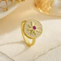 Macro view of gold-plated spinning ring with star motif and red gemstone center - Red Stone Eight-pointed Star (80375) / Open Adjustable / Gold