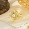 Detail view of rotatable flower ring with micro-set cubic zirconia stones in gold plating - Open Adjustable / Vintage Petal Style (80388)