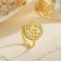 Close-up of gold-plated spinning ring with detailed dragon motif and sparkling zircon stones. - Golden Dragon Relief (80378) / Open Adjustable / Gold