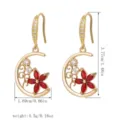 Vintage crescent moon drop earrings featuring red crystal petals and a polished gold finish. - Moon Flower (80430)