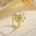 Detailed close-up of a rotating gold flower ring with marquise-cut cubic zirconia petals. - Open Adjustable / Micro-Pave Flower Style (80390)