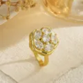 Detailed view of a gold-plated flower ring featuring shimmering clear zirconia stones - Oval Petal Flower (80422) / Open Adjustable / Gold