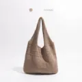 Detailweergave van de kaki opengewerkte gebreide draagtas - Khaki