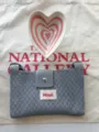 Grey knitted crossbody phone bag detail, soft texture and metal snap closure for daily use. - Gray