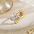 Close-up of a rotating silver and gold bee and sunflower open ring with crystal gems. - Bee Sunflower Spinner Ring (80479) / Two-tone Gold