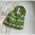 Stylish green knitted crochet tote bag featuring lovely white heart patterns and large capacity - Green
